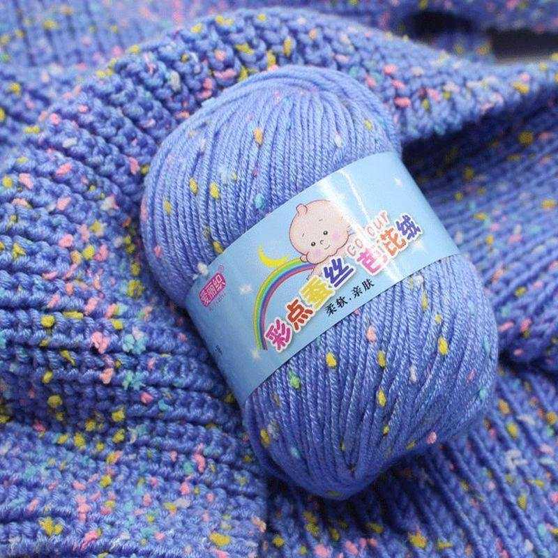Blue cotton crochet yarn with colorful dot patterns, perfect for crafting vibrant knitwear. Soft self-striping 50g crochet wool yarn.