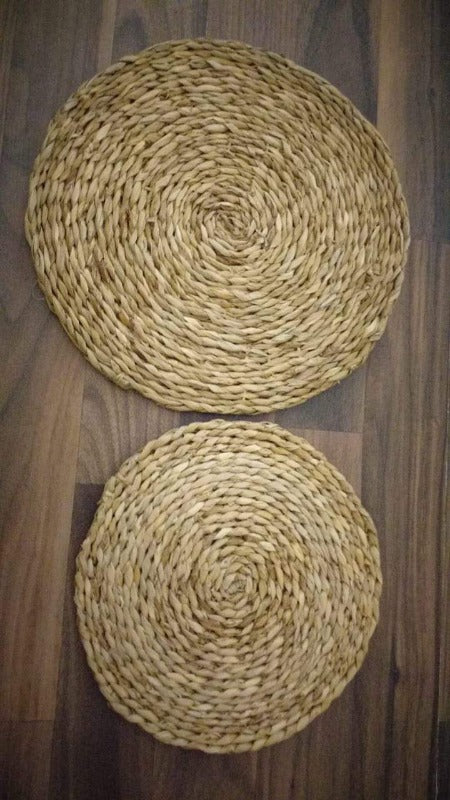 Set of two Seagrass Woven Placemats in 12 and 8 inch sizes, eco woven reed mats for stylish and natural tabletop decor.