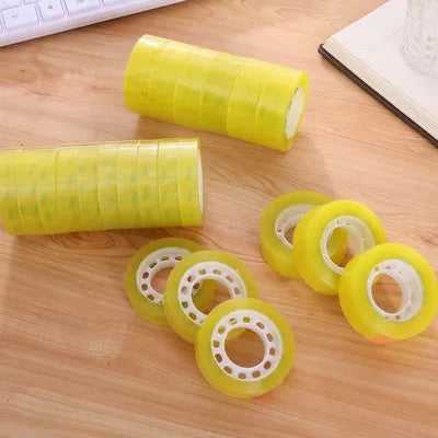Multiple rolls of high-quality 1/2 inch clear cello tape spread on a desk, great for office and packaging applications.