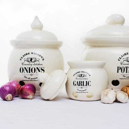 Set of Claire Wilson Country Kitchen ceramic storage jars for garlic, onions, and potatoes, perfect for organized kitchen storage from Bamagate.com.