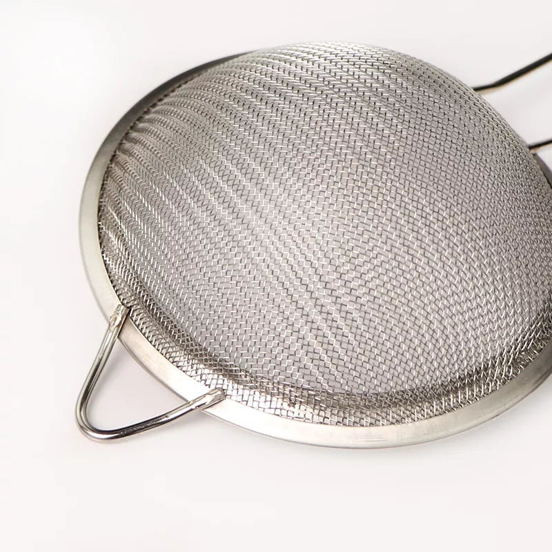 Close-up of Stainless Steel Strainer Fine Mesh 18 cm showing durable woven mesh and sturdy frame. Perfect for filtering tea, juice, or sauces.