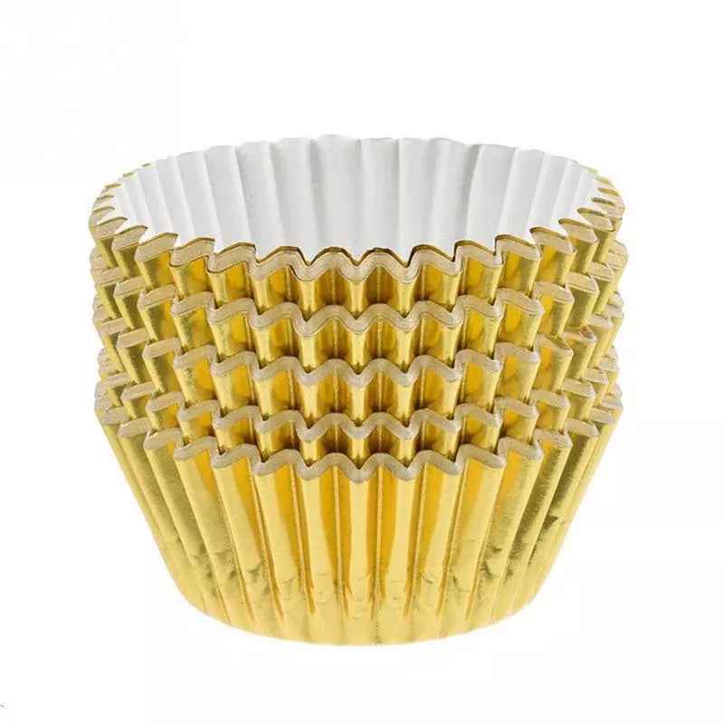 Stack of gold foil cupcake liners with white inner lining, ideal for baking cupcakes and muffins. Buy online at Bamagate.com in Sri Lanka.